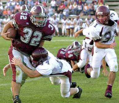 Neal Ricker picks up yardage Friday night against Johnson Co.