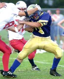 Jake Schuck has his head in a bind by a Union Co defender