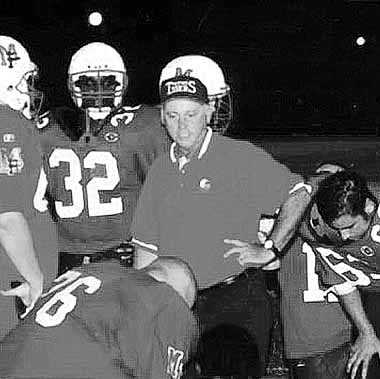Mt. Pleasant head coach Ronnie Dugger talks with players