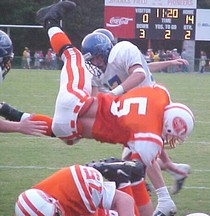 Charles White goes over the top for a touchdown against Boyd-Buchanan