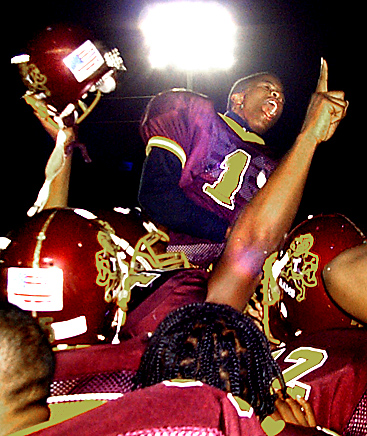 Tyner football players hoisted junior quarterback Marquice Craddock onto their shoulders following their 34-28 win over David Lipscomb