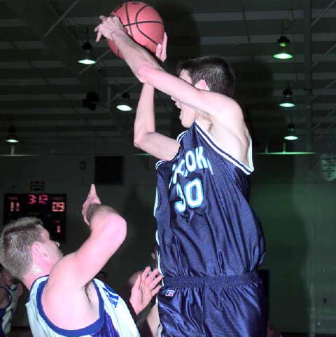 Culleoka- Casey Holt (29 points) goes up over Michael Byrd- Chapel Hill