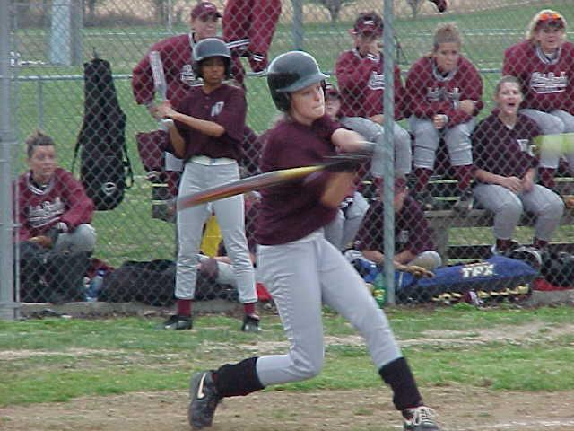 Rachel Arnold drives hit past Gibson County infield