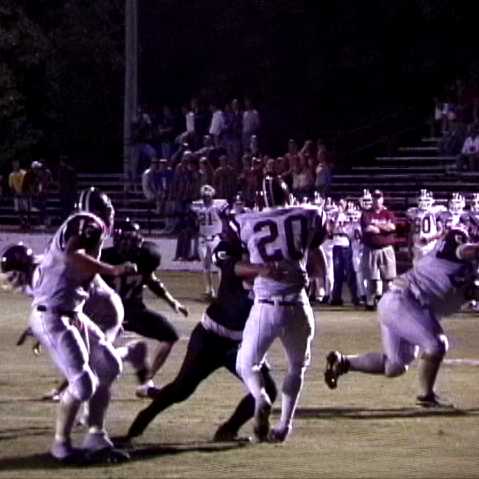 LHS- #45 Daniel Hardiman lays a perfect hit on #20 David Suggs