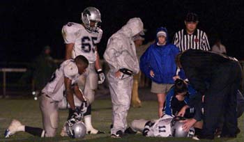 Travada Dixon has the wind knock out of him.