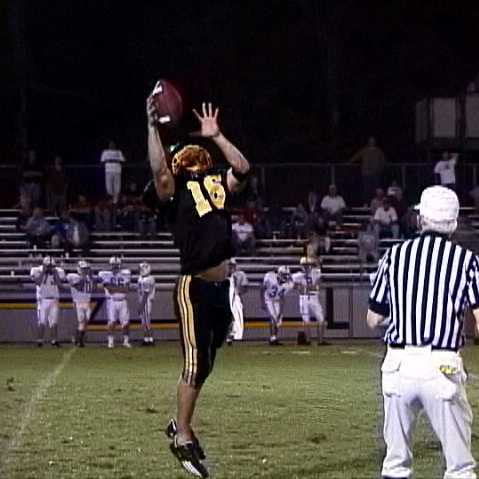 Lewis County- Punter David Sharp makes a leaping catch of a high snap
