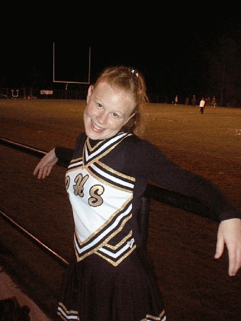 Loretto cheerleader Kala Clayton relaxing after the game.