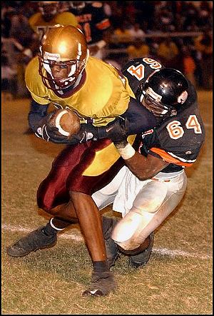 Carlos Armour Jr. draggs Fairley's Anthony Paige for a gain