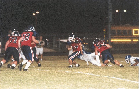 John Ledford attempts to break the tackle of a Lebanon defender.