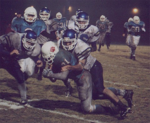 USJ's A. Warren is brought down by JCS's C. Carpenter