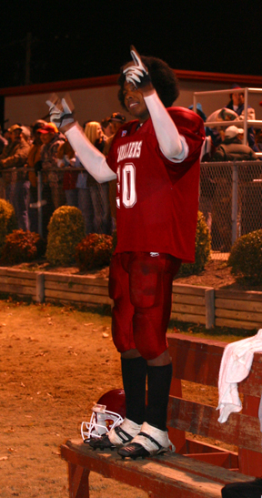 Earnest  leads the crowd in the singing of hey hey goodbye