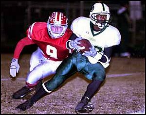 Chris Matesich grabs Jackson Central-Merry running back Tim Powell