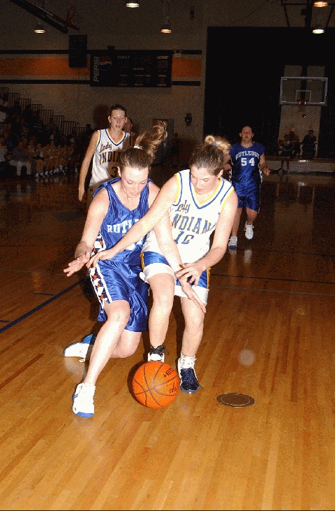 Rutledge's Elizabeth Wolfenbarger and Hancock County's Kim Seal scrap for the loose ball.
