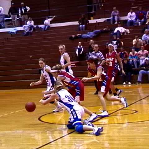Page- #14 Meredith McCarville comes out of this scramble with the ball