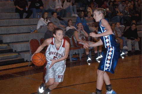 Caroline Grigsby (5) looks to make a move on Casey Jo Wolfenbarger.