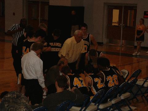Coaches Ellison & Clark giving instructions during a time out