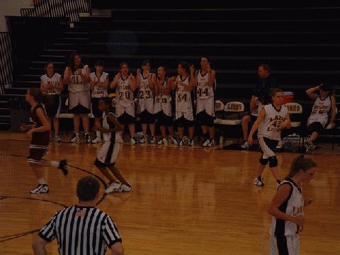 Lady Lions bench cheering their teammates on