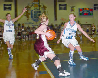Katrina Beechboard and Megan Thompson (LA) apply pressure to Ashley Nichols of Cannon Co.