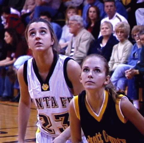 #23 Amanda Baker and #54 Kacee Mitchell watch the free throw