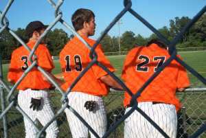 Seniors Tyler Porter #3 and Baker Williams #19 watch the action with teammate Justin Lyles #27
