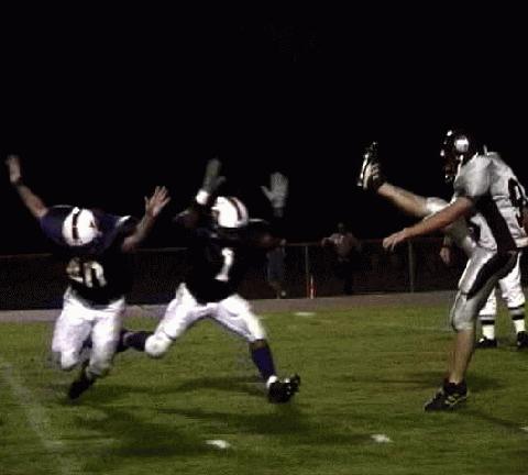 Lawrence Co-  #40 Corey Cull & #1 Dee McCall can't get to the punt