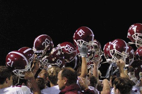 The celebratory helmet raising following the Bears 21-14 win over McEwen