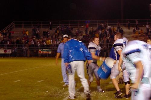 Head Coach Pat Dyer gets a well deserved drenching of water after his very successful win against Clint Satterfield and his Yellow Jackets.