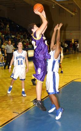 Adam Carter shoots from the baseline.
