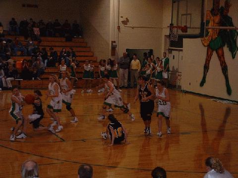 C'Wood #12 Dial & L. Lions #14 Ray fight for control of the ball