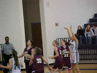 UC Lady Devils # 34 - Candace Shelton firing off a shot.