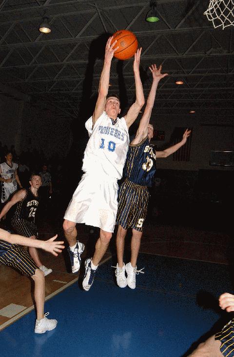 Daniel Singleton (10) rises above Blake Carr (33) for a lay-up in the closing minute