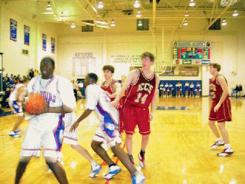 Harding Senior Trey Williams pulls down the rebound to seal a victory.