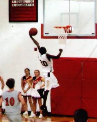 Kenny Cunningham dunks in first half