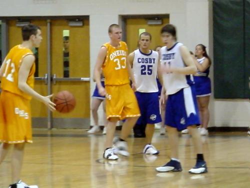 Timmy Blakely (white 11) and Kent Black (white 25) on defense