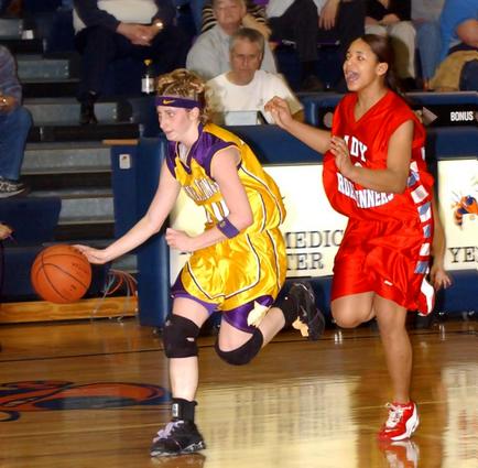 Laura Hall drives down the floor.