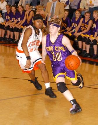 Laura Hall drives the base line again.