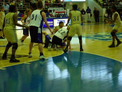 Keisha Chandler (white 22) hustles for a jump ball