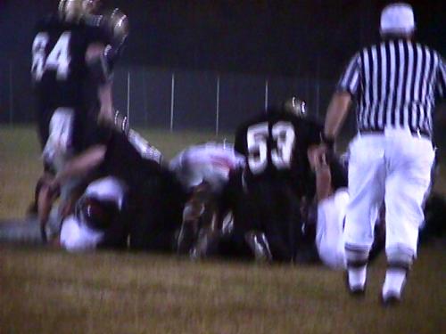 CCHS Senior Colby Garrison (#53) gets into the pile-up.