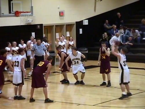 CCHS Senior Eric Stafford (#33) shoots a foul-shot while Harrison Young (#34) and Saylor Walden (#23) prepare to rebound.