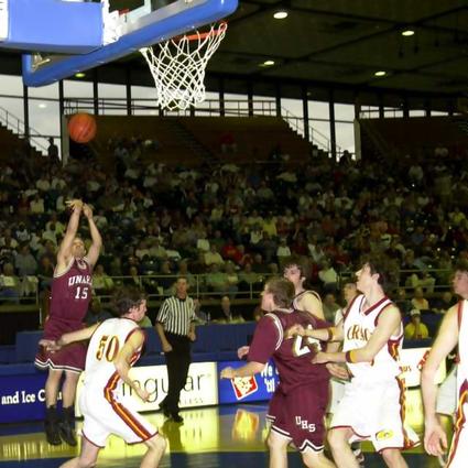 Unaka- #15 Cody Collins shoots as players fight for rebound position