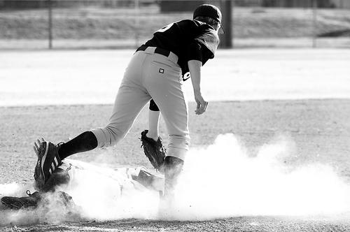 Lighthouse Christian's P. J. Simmons slides into third against FACS.