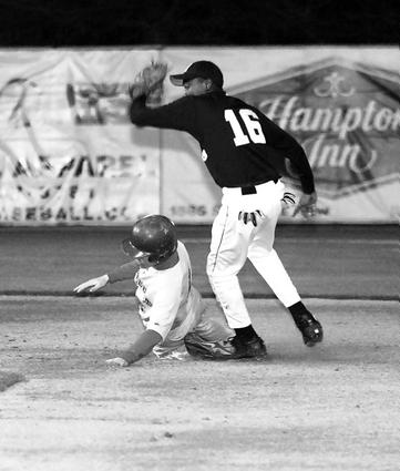 Millington second baseman John Wilson makes a tag out on a Bartlett runner, one of five Trojans catcher Matt Trouy caught stealing.