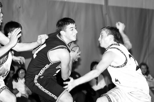 Rebel Tyler Sutton drives to the basket for two points.