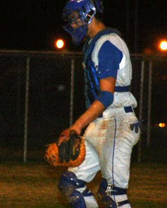 Chris Rezabek walks back to home plate.