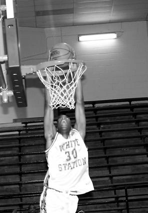 White Station's J.P. Prince dunks early in the second quarter against Millington.