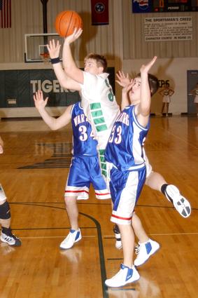 Rockwood's Brian Reed splits the defense.