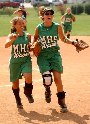 Midway's Lyndsay Davidson (left) and Brittanie Viar celebrate after the Lady Waves' sectional victory over University School of Johnson City.