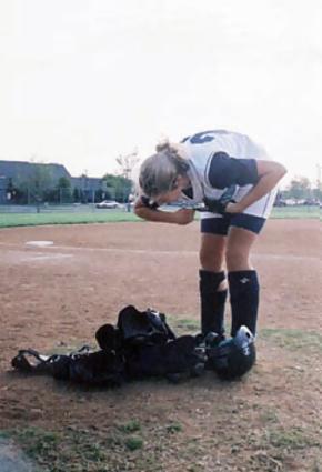 Monica West (C) getting ready to hit ...