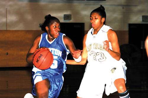 Millington's Michelle Malone tries to stop the drive.