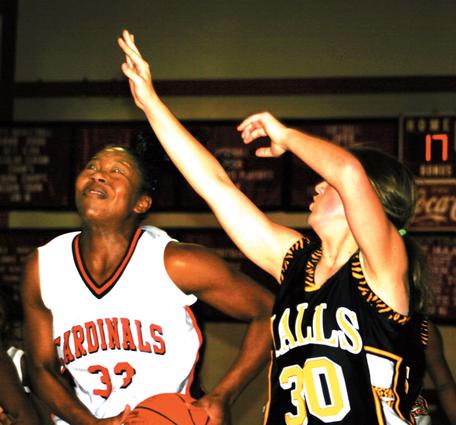Lady Cardinal Ciera Boyce drives to the basket against Halls.